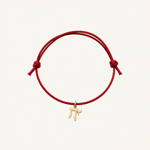 Red adjustable cord bracelet with a gold-tone Chai charm.