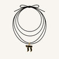 Black multi-strand cord necklace with a Chai pendant.