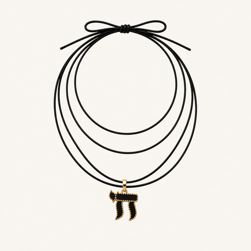Black multi-strand cord necklace with a Chai pendant.