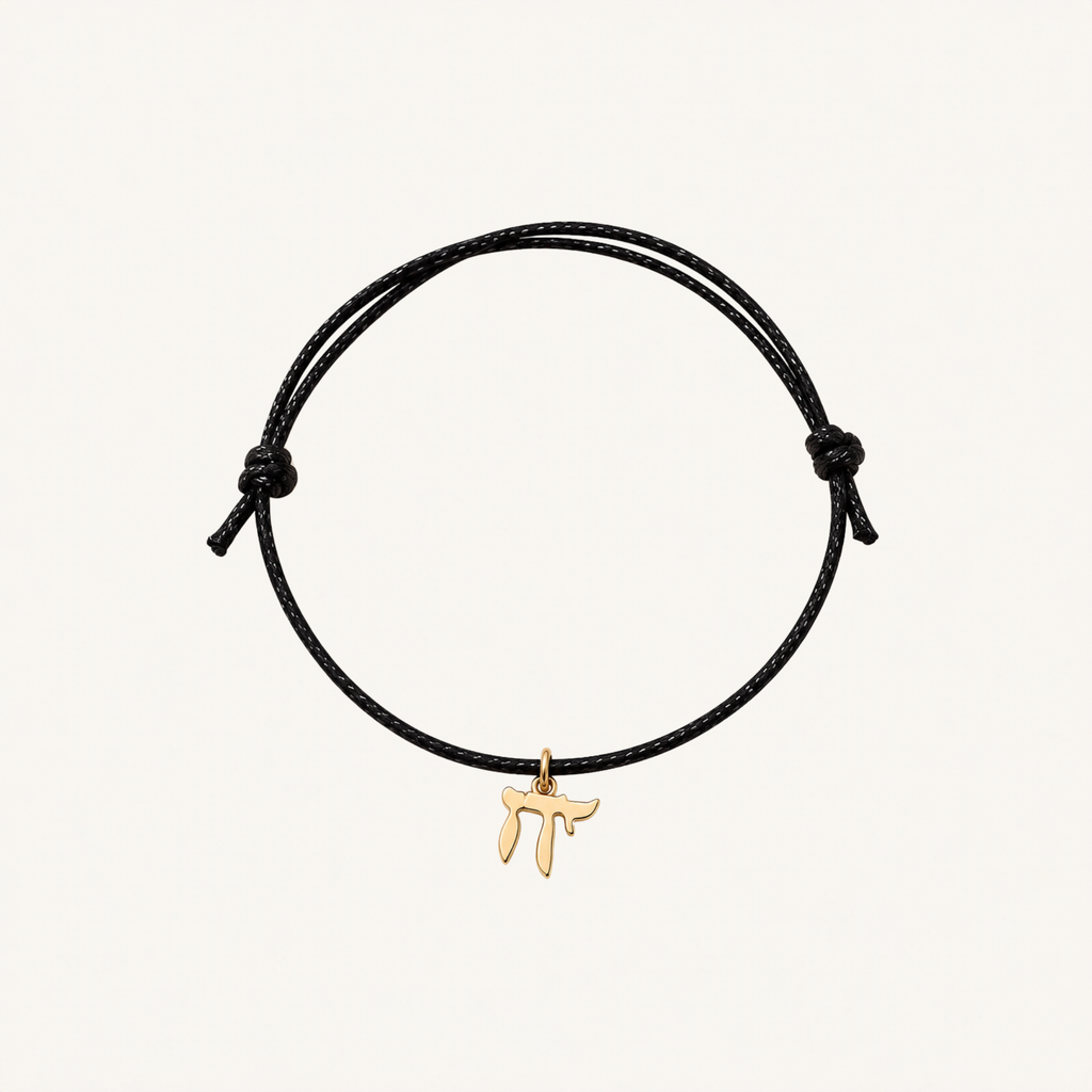 Black adjustable cord bracelet with a gold-tone Chai charm.