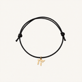 Black adjustable cord bracelet with a gold-tone Chai charm.