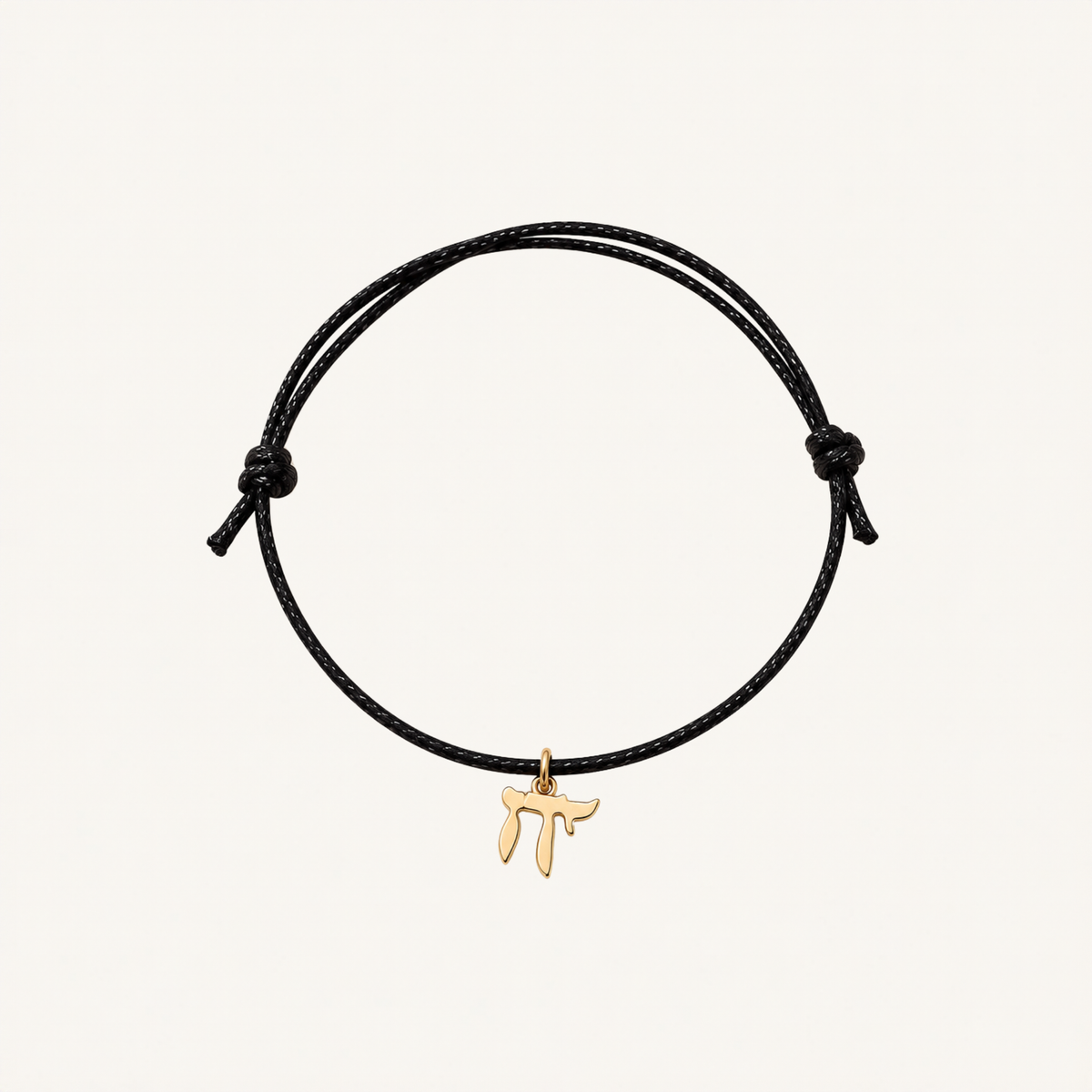 Black adjustable cord bracelet with a gold-tone Chai charm.
