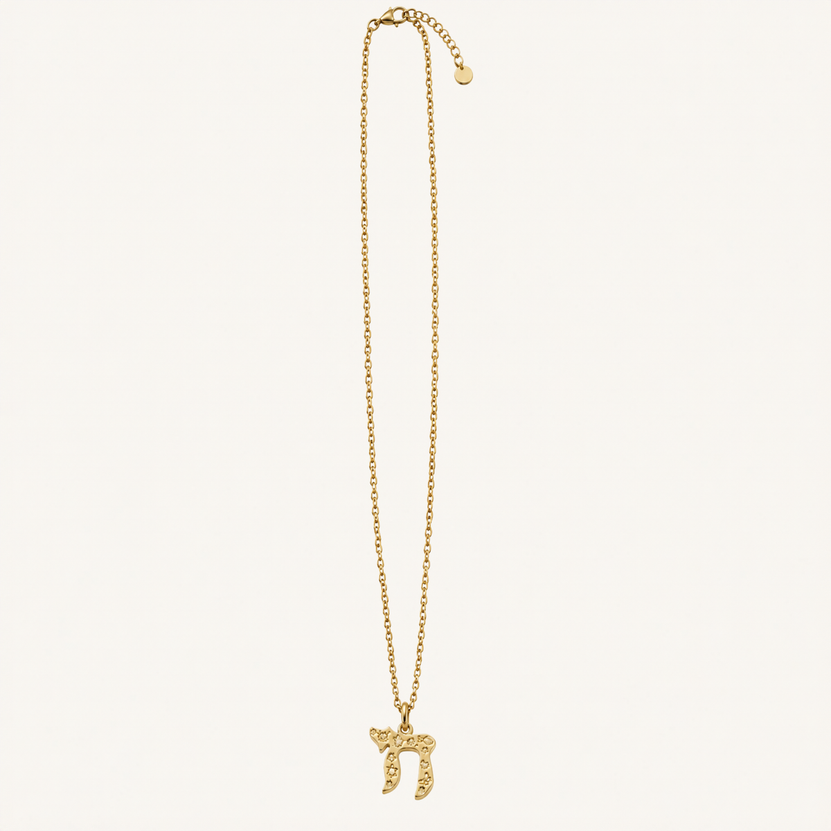 Gold-tone chain necklace with a textured Chai pendant.
