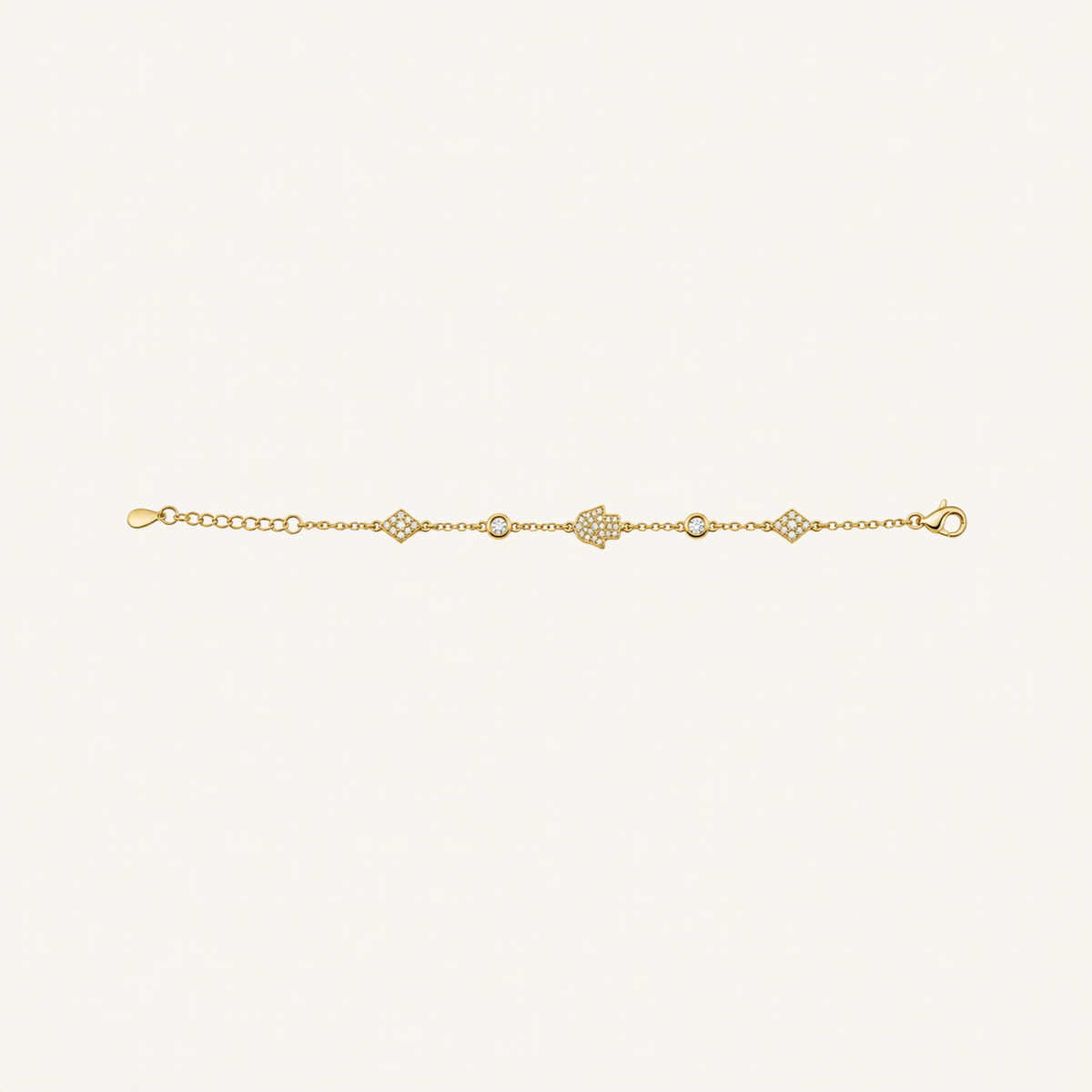 A delicate gold chain bracelet featuring a central pavé diamond heart motif and smaller diamond accents, displayed horizontally on a clean off-white background.