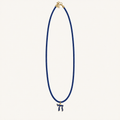 Royal blue cord necklace with a blue Chai pendant edged in gold-tone metal.