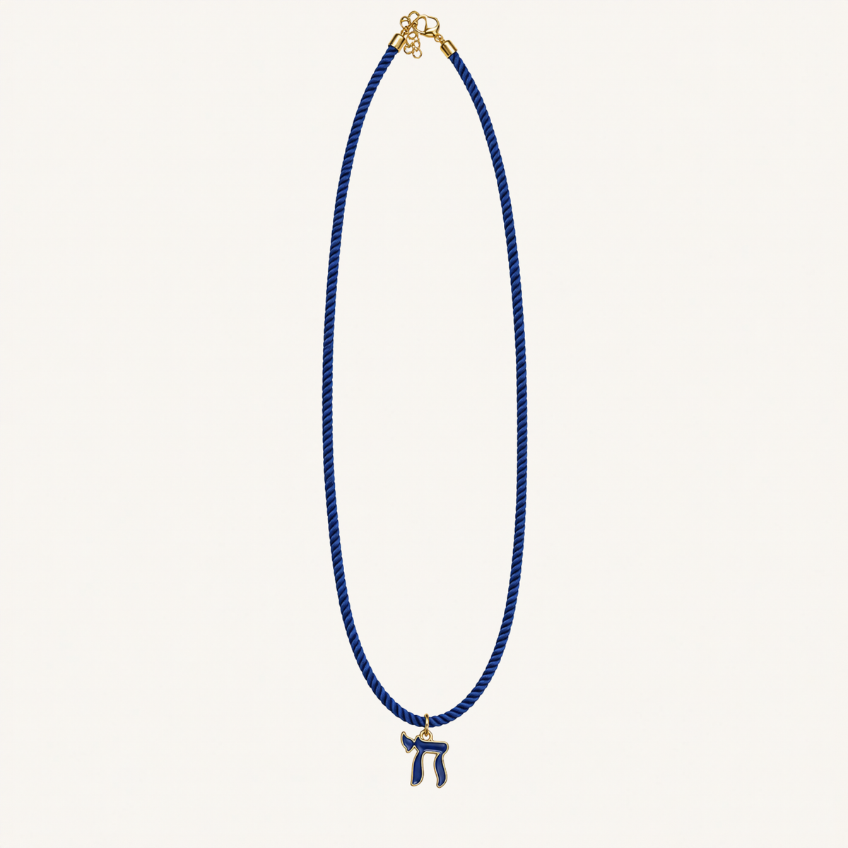 Royal blue cord necklace with a blue Chai pendant edged in gold-tone metal.
