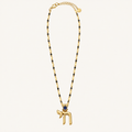 Gold-tone chain necklace with black bead accents and a Chai pendant with a blue Star of David.
